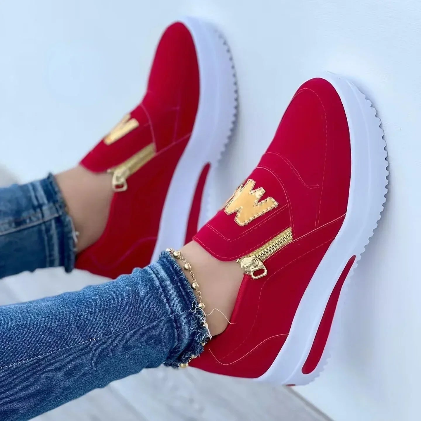 Casual sneakers with flat soles and side zippers